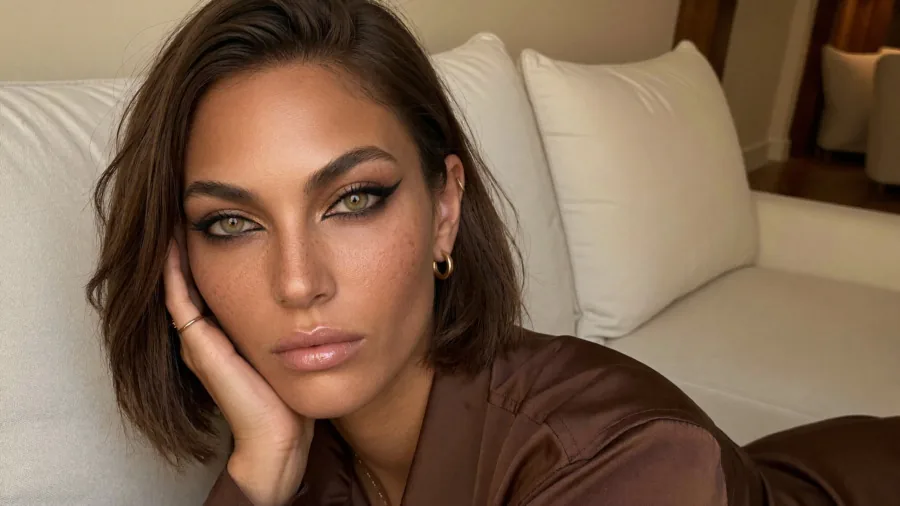 Koda with dramatic siren eye makeup, a long smoky winged liner and bronze lid on hazel-green eyes, one of six eye makeup looks